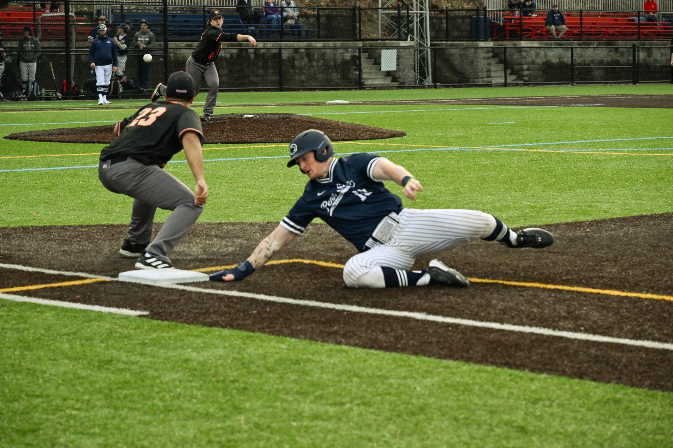 Scranton's Guy Mushow (10) slides back into first base during a game against Kings College at Schautz Stadium on Sunday. Scranton split with Kings (7-4, 6-11), earning their first win in 2024.