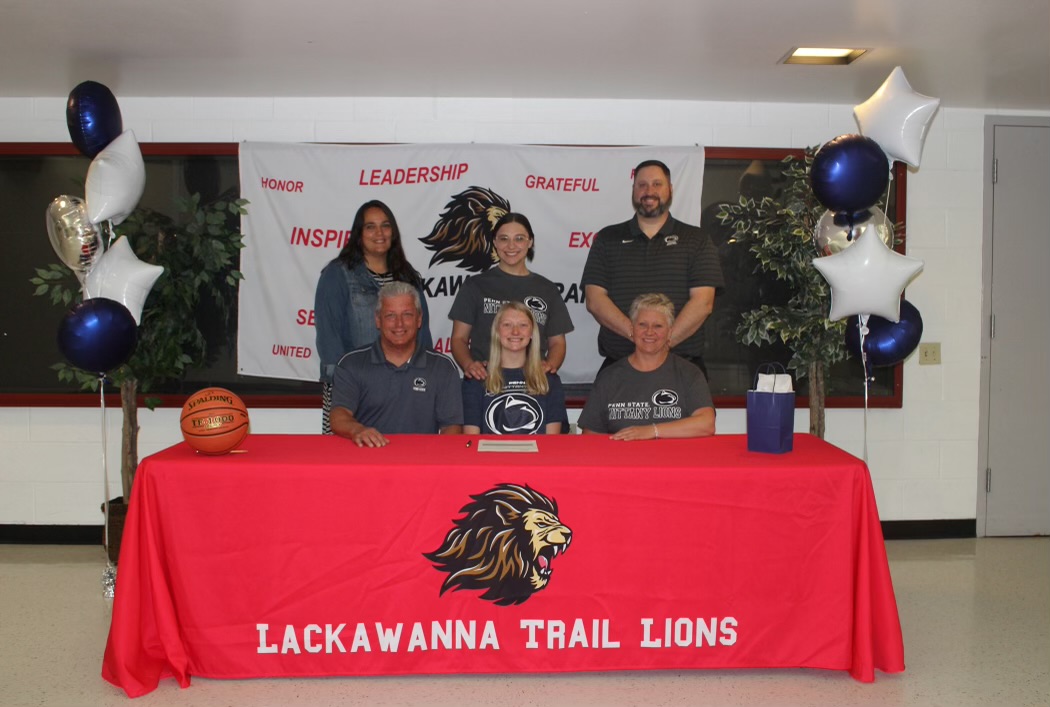 Lackawanna Trail senior Megan Gatto signed her intent to play basketball at Penn State Scranton. Seated from left are dad Steve Gatto, Megan, and mom Kristen Amori. In the back are Mark Murphy, principal; Mallory Griggs and Jody Kwiatkowski, Trail basketball coaches; sister Lauren Gatto; Ed Guidula, LT AD; and Tom McIntyre, PSU coach.